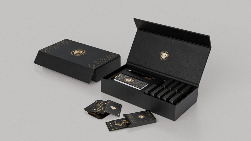 Al Nassr FC Baloot luxury gift box closed and open — side angle showing card deck inside premium matte black packaging