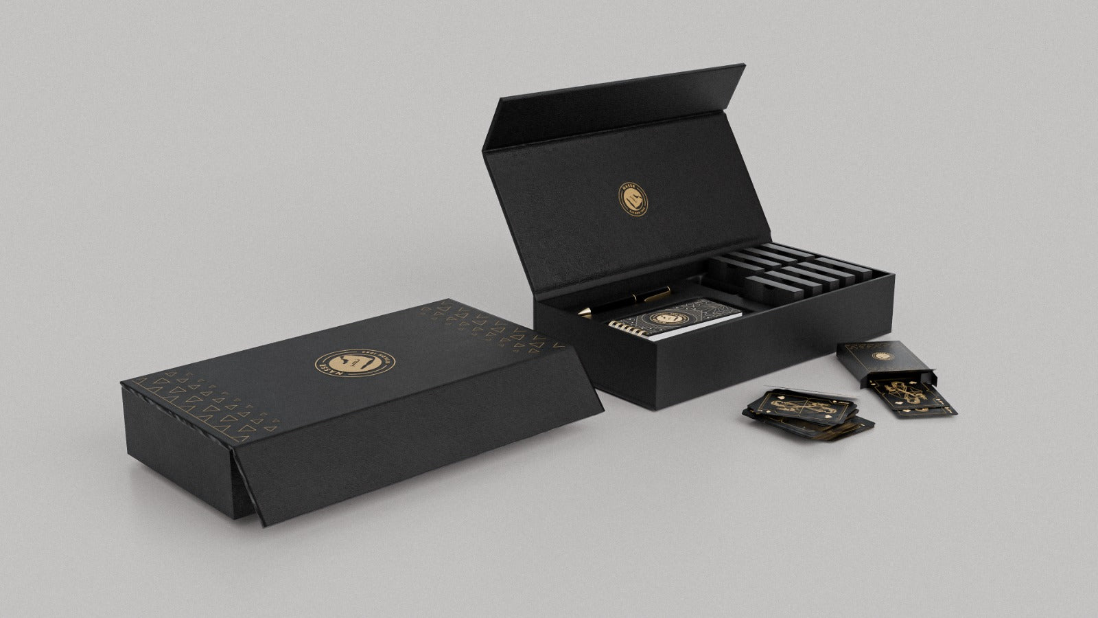 Al Nassr FC Baloot cards spread out showing black and gold design with Jack card visible — deck and slide box