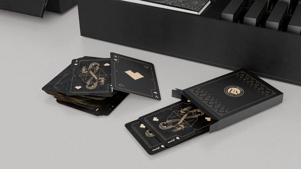 Al Nassr FC Baloot deck of cards fanned out showing black matte finish with gold foil court card art