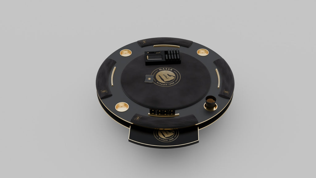 Al Nassr FC Baloot Table surface close-up — Nassr Riyadh 1955 gold crest on matte black felt with card deck and shuffler