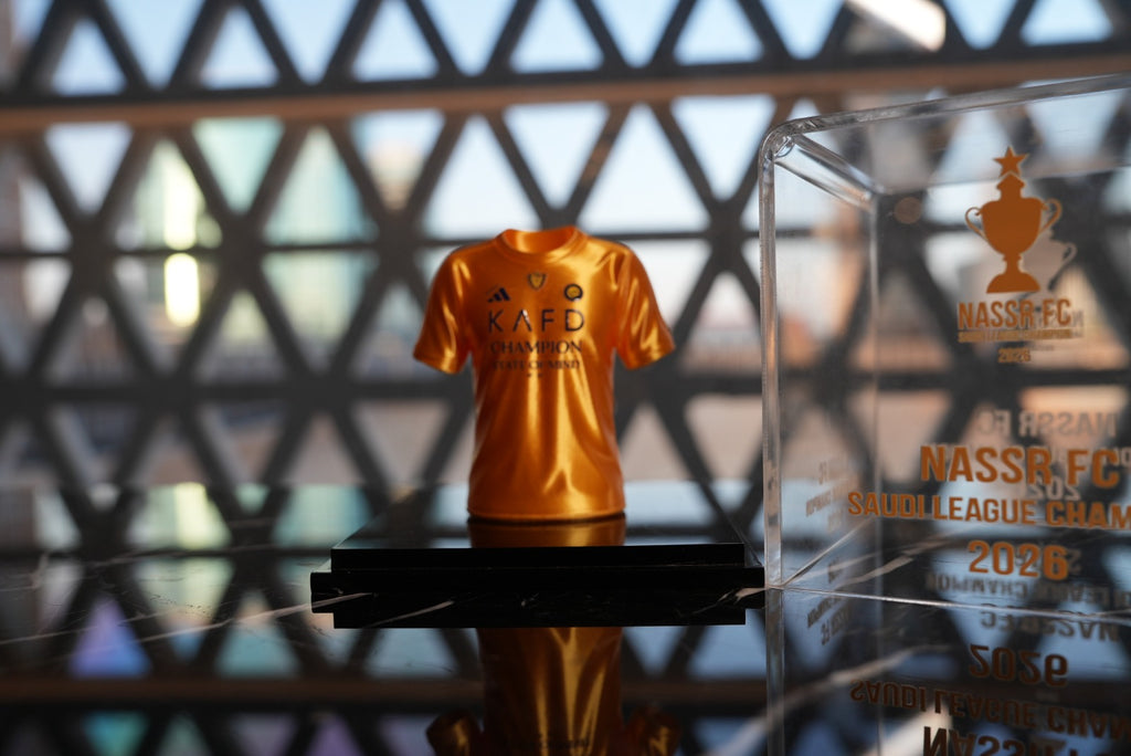 Al Nassr FC Saudi League Champion 2026 mini jersey in acrylic display case — front view