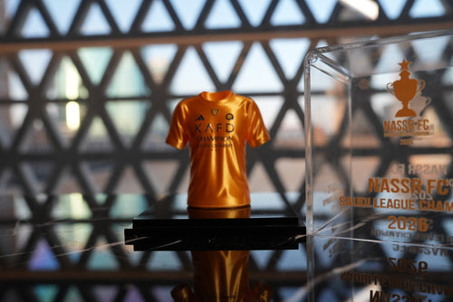 Al Nassr FC Saudi League Champion 2026 mini jersey in acrylic display case — front view