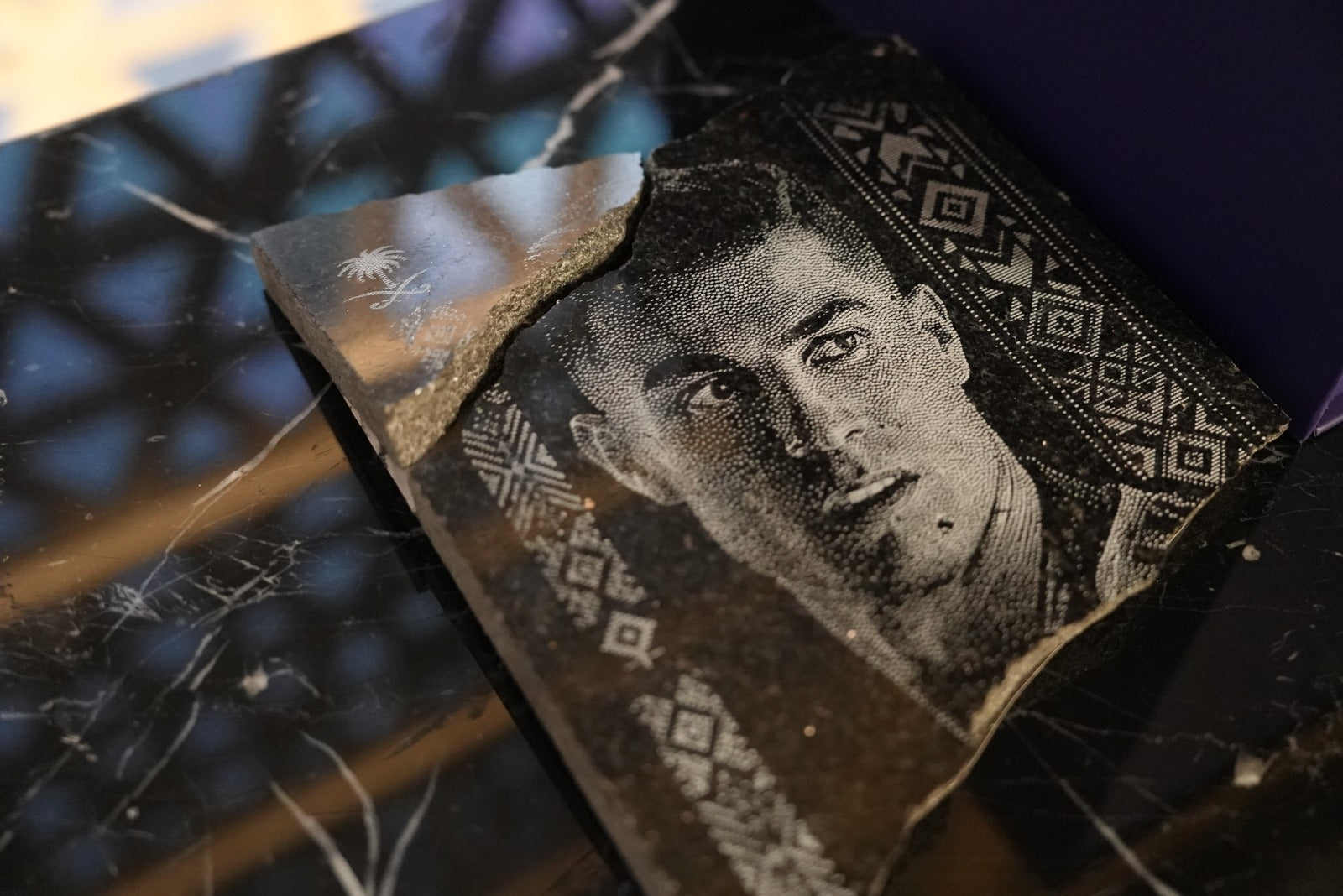 Al Nassr FC engraved stone portrait displayed on glowing purple acrylic stand — full view with Saudi geometric border