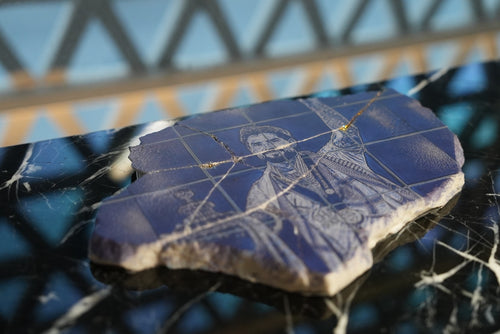 Al Nassr FC engraved stone collectible — close-up side angle showing natural stone texture and gold crack detail