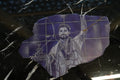 Al Nassr FC laser-engraved stone slab — champion player portrait with gold kintsugi cracks on marble surface